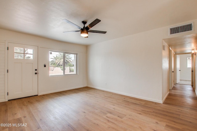 entrance foyer with light wood-style floors, ceiling fan, and baseboards