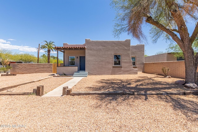 2956 N Tyndall Ave, Tucson, AZ 85719 - back of house with fence and stucco siding