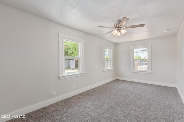 2956 N Tyndall Ave, Tucson, AZ 85719 - unfurnished room with baseboards, carpet floors, and ceiling fan