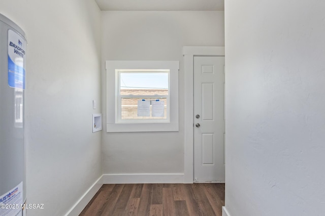2956 N Tyndall Ave, Tucson, AZ 85719 - doorway to outside featuring dark wood-style flooring and baseboards
