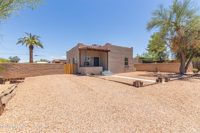 2956 N Tyndall Ave, Tucson, AZ 85719 - back of property with stucco siding and a tiled roof