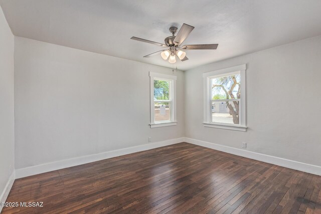 2956 N Tyndall Ave, Tucson, AZ 85719 - empty room featuring dark wood-type flooring, baseboards, and ceiling fan