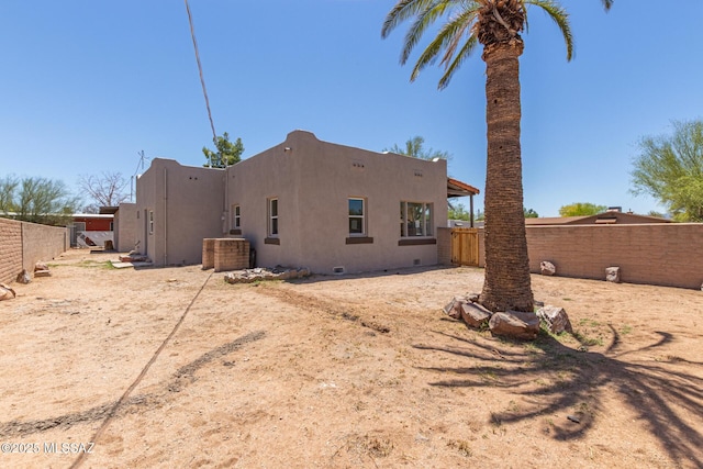 2956 N Tyndall Ave, Tucson, AZ 85719 - back of house with fence and stucco siding