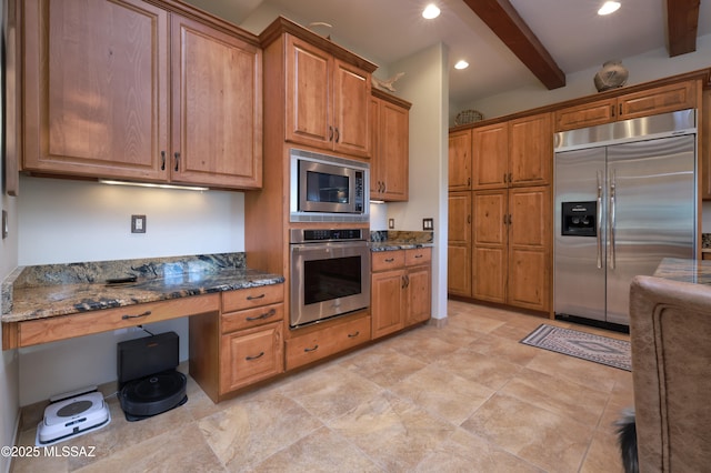 12800 W Arivaca Rd, Amado, AZ 85645 - kitchen with built in appliances, beamed ceiling, dark stone counters, brown cabinets, and recessed lighting