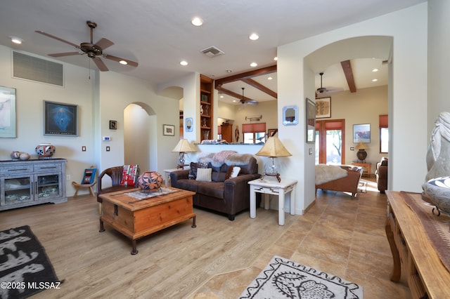 12800 W Arivaca Rd, Amado, AZ 85645 - living room featuring arched walkways, ceiling fan, and recessed lighting