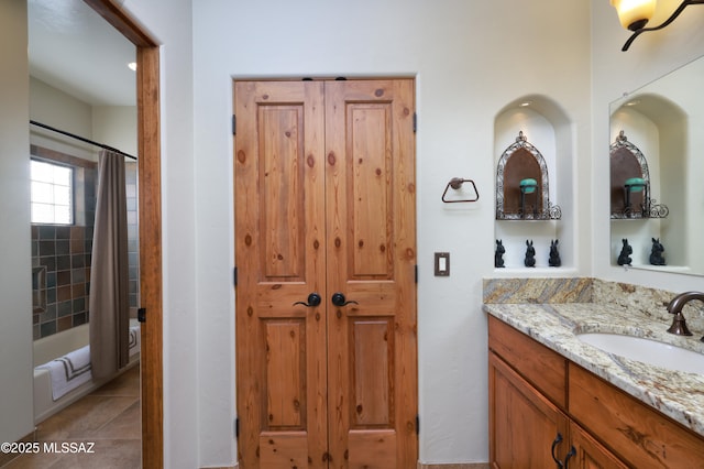 12800 W Arivaca Rd, Amado, AZ 85645 - full bath with vanity, shower / bath combo with shower curtain, and tile patterned flooring