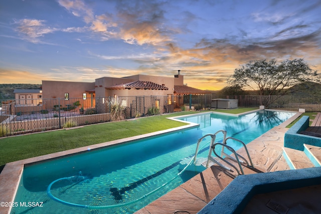 12800 W Arivaca Rd, Amado, AZ 85645 - pool at dusk with a hot tub