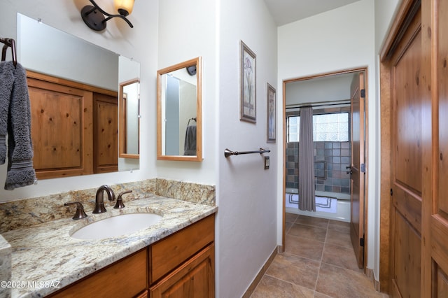 12800 W Arivaca Rd, Amado, AZ 85645 - bathroom with vanity, baseboards, and tub / shower combination