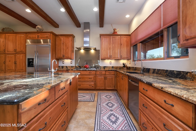 12800 W Arivaca Rd, Amado, AZ 85645 - kitchen featuring a sink, appliances with stainless steel finishes, wall chimney range hood, brown cabinets, and beamed ceiling