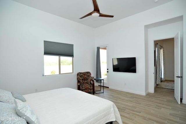 432 N Heritage Point Pl, Sahuarita, AZ 85629 - bedroom with light wood-style flooring, baseboards, and ceiling fan