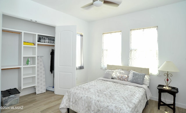 432 N Heritage Point Pl, Sahuarita, AZ 85629 - bedroom featuring wood finished floors, a closet, ceiling fan, and baseboards
