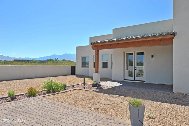432 N Heritage Point Pl, Sahuarita, AZ 85629 - view of patio with a mountain view, french doors, and a fenced backyard