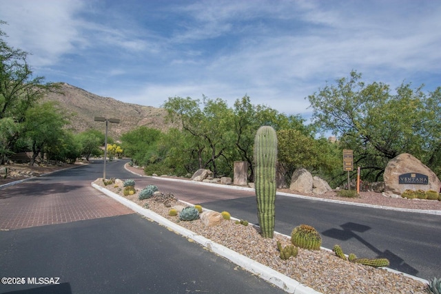 6655 N Canyon Crest Dr Unit 13277, Tucson, AZ 85750 - view of asphalt street featuring a mountain view, street lighting, and curbs