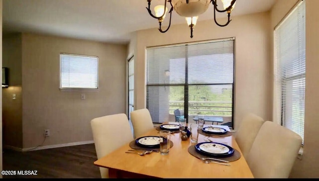 6655 N Canyon Crest Dr Unit 13277, Tucson, AZ 85750 - dining space featuring a chandelier, dark wood-type flooring, and baseboards