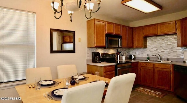 6655 N Canyon Crest Dr Unit 13277, Tucson, AZ 85750 - kitchen featuring stainless steel microwave, range with electric stovetop, dishwasher, decorative backsplash, and a chandelier