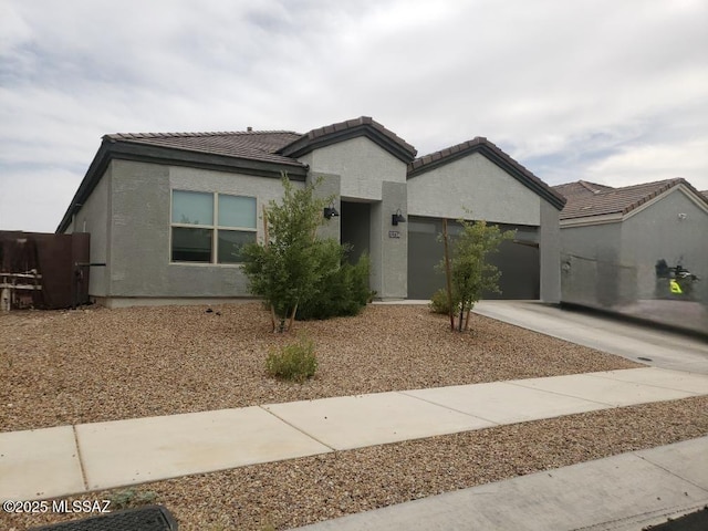 12734 E Russo Dr, Vail, AZ 85641 - single story home featuring a garage, concrete driveway, a tiled roof, and stucco siding