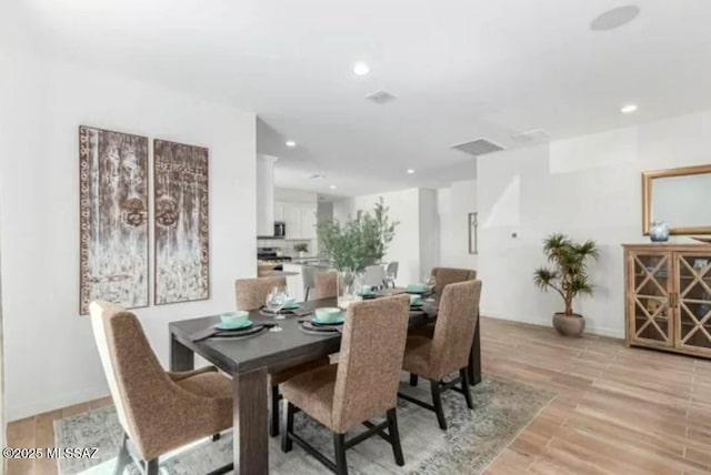 12734 E Russo Dr, Vail, AZ 85641 - dining room featuring recessed lighting and light wood-style flooring