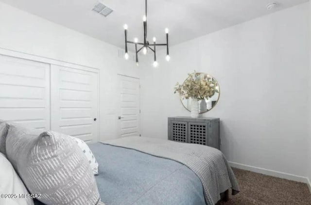 12734 E Russo Dr, Vail, AZ 85641 - carpeted bedroom with a chandelier, baseboards, and a closet
