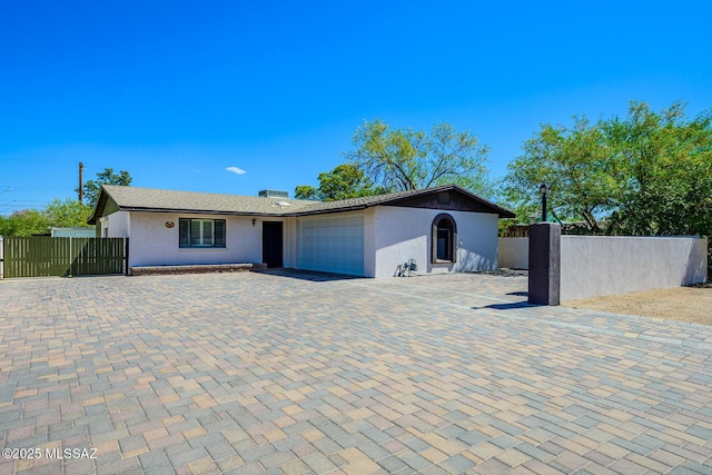 2607 E Adams St, Tucson, AZ 85716 - single story home featuring an attached garage, stucco siding, fence, and decorative driveway