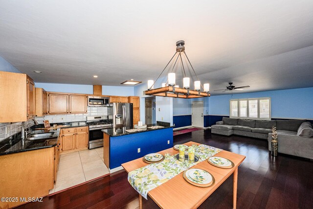 2607 E Adams St, Tucson, AZ 85716 - dining space featuring a ceiling fan, light wood finished floors, and a chandelier