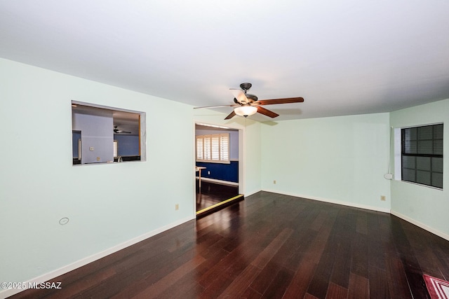 2607 E Adams St, Tucson, AZ 85716 - unfurnished room with ceiling fan, wood finished floors, and baseboards