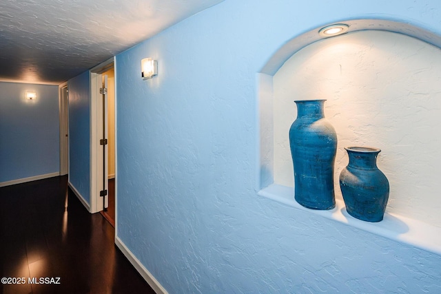 2607 E Adams St, Tucson, AZ 85716 - corridor featuring baseboards and wood finished floors