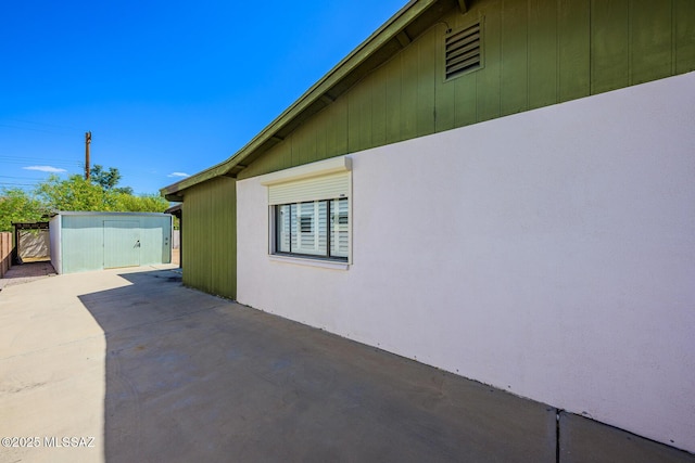 2607 E Adams St, Tucson, AZ 85716 - view of side of property featuring a patio, a shed, an outdoor structure, and fence