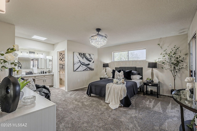 2756 S Via Del Bac, Green Valley, AZ 85622 - bedroom featuring carpet, baseboards, ensuite bathroom, a chandelier, and a textured ceiling