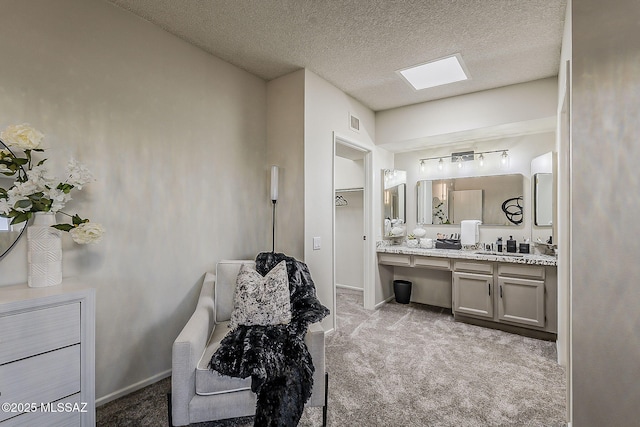 2756 S Via Del Bac, Green Valley, AZ 85622 - bathroom featuring a textured ceiling, vanity, and baseboards