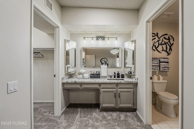 2756 S Via Del Bac, Green Valley, AZ 85622 - bathroom with vanity, toilet, and baseboards