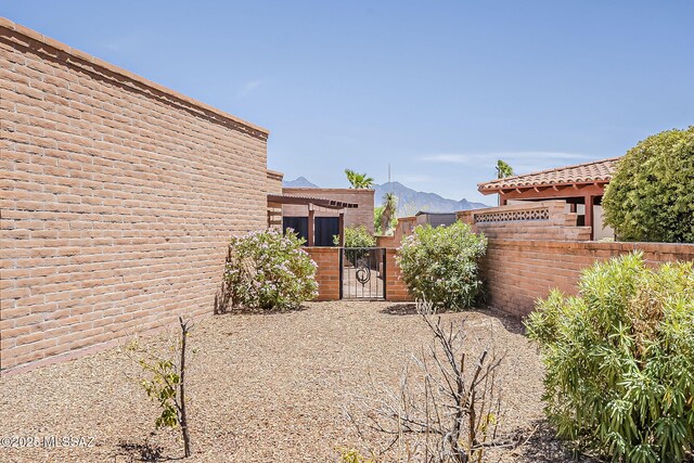 2756 S Via Del Bac, Green Valley, AZ 85622 - view of yard featuring a gate, fence, and a mountain view