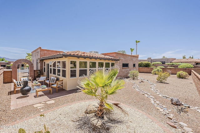 2756 S Via Del Bac, Green Valley, AZ 85622 - back of property featuring a patio area, a fenced backyard, a tiled roof, and an outdoor hangout area