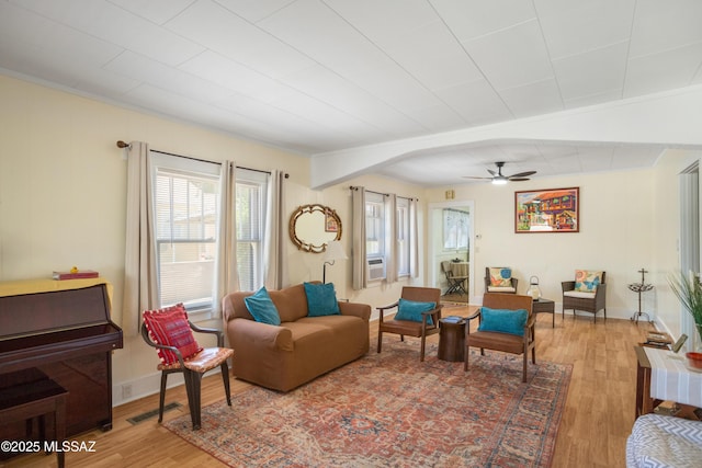 24 Black Knob, Bisbee, AZ 85603 - living area featuring wood finished floors, a ceiling fan, baseboards, cooling unit, and ornamental molding