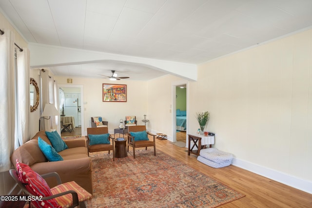 24 Black Knob, Bisbee, AZ 85603 - living room featuring wood finished floors, ceiling fan, and baseboards