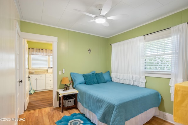 24 Black Knob, Bisbee, AZ 85603 - bedroom with ornamental molding, wood finished floors, multiple windows, and ceiling fan