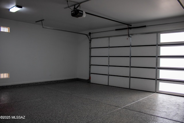 481 Calle Cipres, Rio Rico, AZ 85648 - garage featuring a garage door opener and baseboards