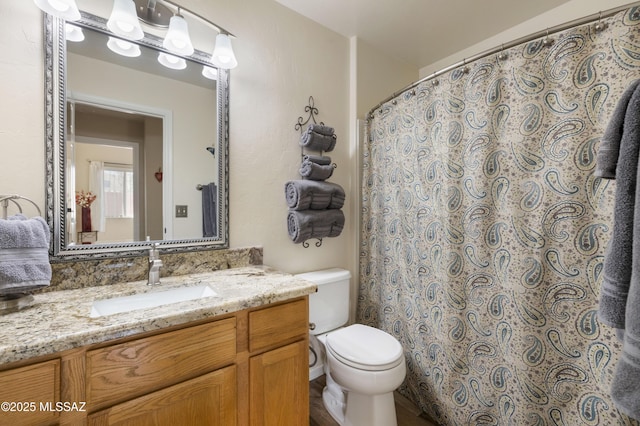 9429 N Elan Ln, Tucson, AZ 85742 - bathroom featuring toilet, vanity, and a shower with shower curtain