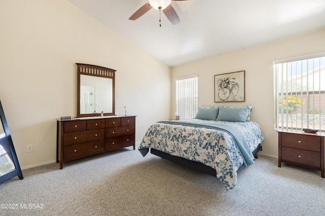 9429 N Elan Ln, Tucson, AZ 85742 - bedroom featuring light colored carpet, baseboards, and high vaulted ceiling