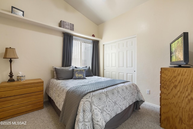 9429 N Elan Ln, Tucson, AZ 85742 - carpeted bedroom featuring vaulted ceiling, a closet, and baseboards
