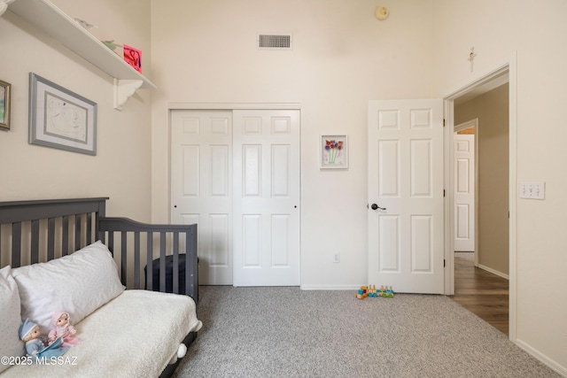 9429 N Elan Ln, Tucson, AZ 85742 - bedroom with carpet floors, a closet, baseboards, and a towering ceiling