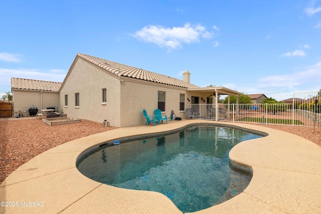 9429 N Elan Ln, Tucson, AZ 85742 - view of pool featuring a fenced backyard, a patio, and a ceiling fan