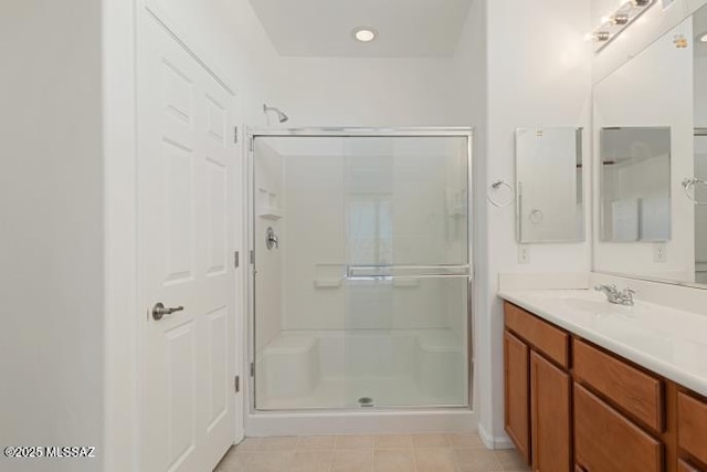 6902 W Leeward Cove Way, Tucson, AZ 85757 - full bathroom featuring a stall shower, vanity, and tile patterned floors