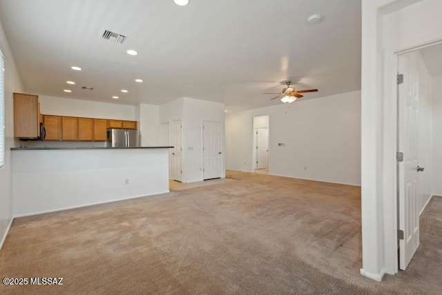 6902 W Leeward Cove Way, Tucson, AZ 85757 - unfurnished living room featuring a ceiling fan, recessed lighting, and light carpet