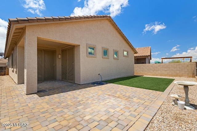 6902 W Leeward Cove Way, Tucson, AZ 85757 - back of property featuring stucco siding, a patio, and a tile roof