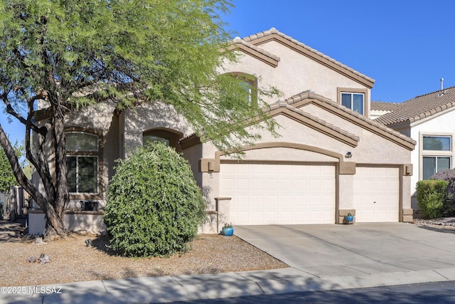 368 W Sacaton Canyon Dr, Oro Valley, AZ 85755 - view of front of home featuring an attached garage, stucco siding, a tile roof, and concrete driveway
