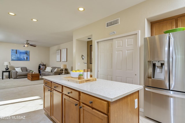 368 W Sacaton Canyon Dr, Oro Valley, AZ 85755 - kitchen with stainless steel refrigerator with ice dispenser, recessed lighting, ceiling fan, a center island, and light tile patterned floors