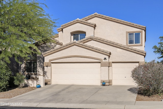 368 W Sacaton Canyon Dr, Oro Valley, AZ 85755 - view of front of property featuring a tile roof, driveway, stucco siding, and an attached garage