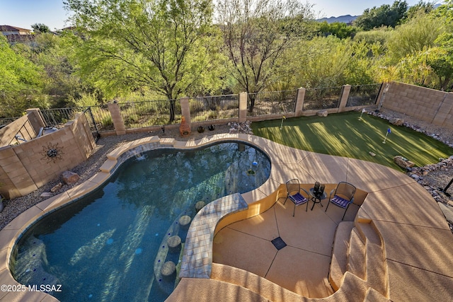 368 W Sacaton Canyon Dr, Oro Valley, AZ 85755 - view of pool featuring an area to practice putting, a fenced backyard, and a patio area
