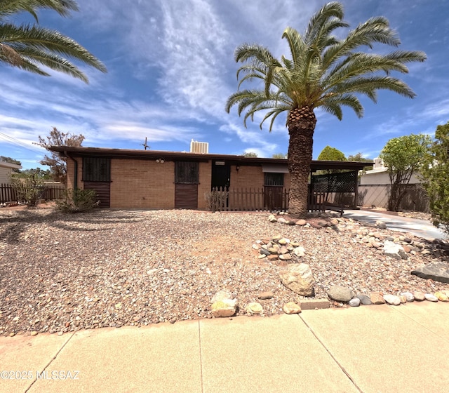 6509 E 39th St, Tucson, AZ 85730 - ranch-style house with fence and brick siding