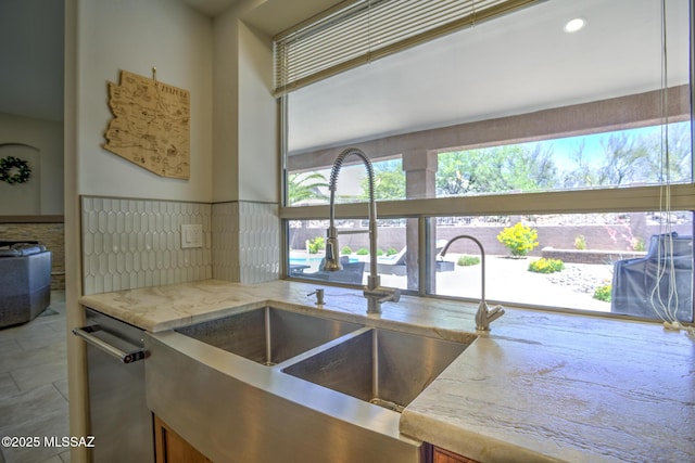 218 W Milbrae Springs Dr, Oro Valley, AZ 85755 - kitchen with a sink, light stone counters, and stainless steel dishwasher
